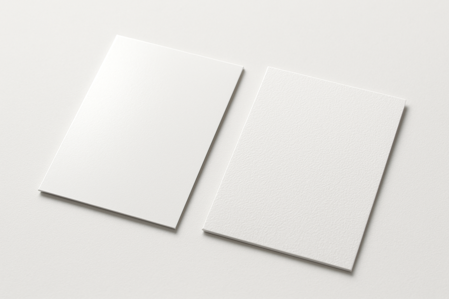 show 2 peices of card, on is 400gsm silk, and one is a 400gsm textured board, both blank